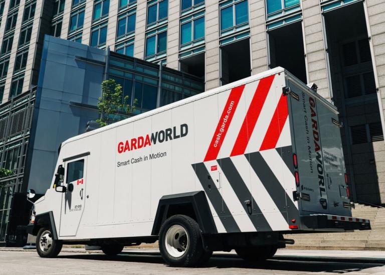 GardaWorld Cash truck picking up cash for store distribution