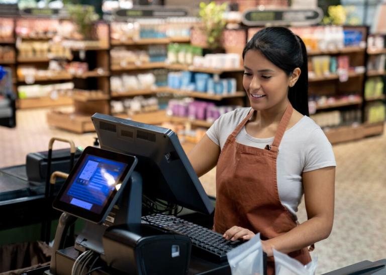 cashier using POS system for better cash management