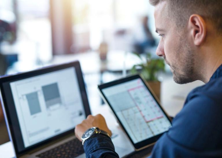 financial employee managing cash on computer