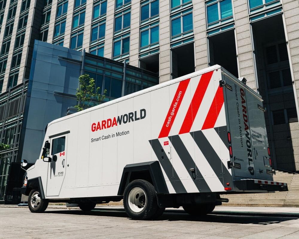 GardaWorld Cash truck picking up cash for store distribution
